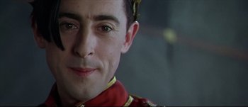 Movie still from “Titus” (1999), directed by Julie Taymor – A person wearing a uniform; Close Up shot, Over the shoulder angle