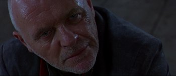 Movie still from “Titus” (1999), directed by Julie Taymor – An older man with a beard and a mustache; Close Up shot, Low angle