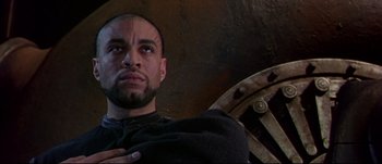 Movie still from “Titus” (1999), directed by Julie Taymor – A person with a beard; Close Up shot, Low angle