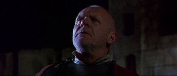 Movie still from “Titus” (1999), directed by Julie Taymor – An older man looking up into the sky; Close Up shot, Low angle