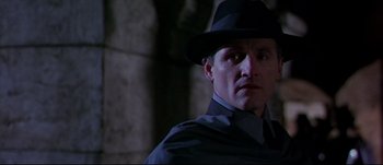 Movie still from “Titus” (1999), directed by Julie Taymor – A person wearing a hat; Close Up shot, Low angle
