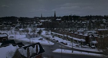 Movie still from “To Die For” (1995), directed by Gus Van Sant – A view of a snowy city at night; Extreme Wide shot, High angle