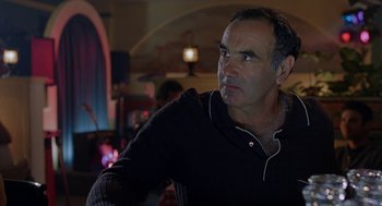 Movie still from “To Die For” (1995), directed by Gus Van Sant – A person wearing a jacket; Close Up shot, Over the shoulder angle