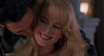 Movie still from “To Die For” (1995), directed by Gus Van Sant – A woman's face with long blonde hair; Close Up shot, Over the shoulder angle