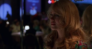 Movie still from “To Die For” (1995), directed by Gus Van Sant – A woman with long blonde hair is looking into the distance; Close Up shot, Over the shoulder angle