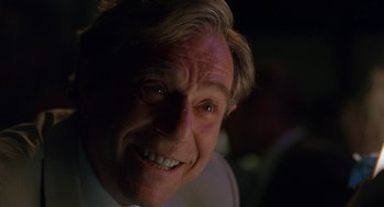 Movie still from “To Die For” (1995), directed by Gus Van Sant – A person smiling for the camera; Close Up shot, Low angle
