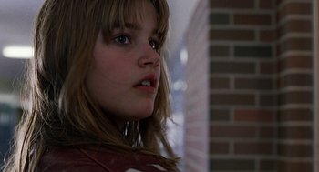 Movie still from “To Die For” (1995), directed by Gus Van Sant – A person with long brown hair; Close Up shot, Low angle