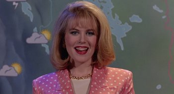 Movie still from “To Die For” (1995), directed by Gus Van Sant – A person wearing a suit and tie; Close Up shot, Low angle