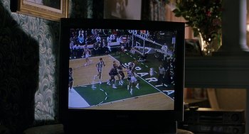 Movie still from “To Die For” (1995), directed by Gus Van Sant – A television screen showing a basketball game on a court; Extreme Close Up shot, High angle