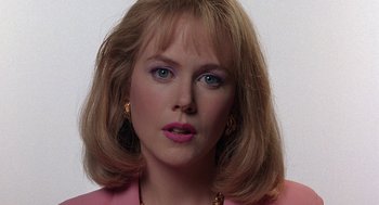 Movie still from “To Die For” (1995), directed by Gus Van Sant – A person wearing a pink jacket; Close Up shot, Overhead angle