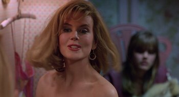 Movie still from “To Die For” (1995), directed by Gus Van Sant – A beautiful woman with blonde hair and a bare shoulder; Close Up shot, Over the shoulder angle