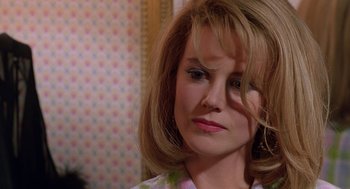 Movie still from “To Die For” (1995), directed by Gus Van Sant – A person wearing a floral shirt; Close Up shot, Over the shoulder angle