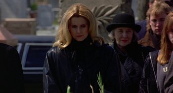 Movie still from “To Die For” (1995), directed by Gus Van Sant – A woman in a black jacket and a woman in a black hat; Medium shot, Low angle