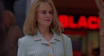 Movie still from “To Die For” (1995), directed by Gus Van Sant – A woman with blonde hair and a blue jacket; Close Up shot, Over the shoulder angle