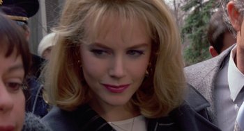 Movie still from “To Die For” (1995), directed by Gus Van Sant – A person with blonde hair; Close Up shot, High angle