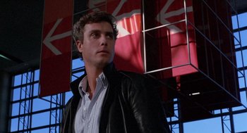 Movie still from “To Live and Die in L.A.” (1985), directed by William Friedkin – A man wearing a leather jacket looking to his left; Close Up shot, Low angle