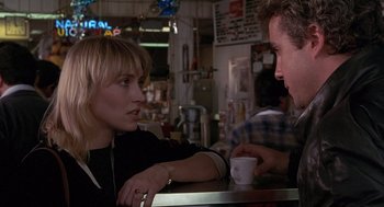 Movie still from “To Live and Die in L.A.” (1985), directed by William Friedkin – A man and a woman sitting at a counter; Medium shot, Over the shoulder angle