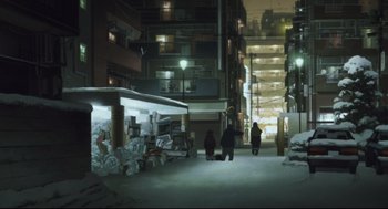 Movie still from “Tokyo Godfathers” (2003), directed by Shôgo Furuya – People are walking in the dark in an industrial setting; Extreme Wide shot, Low angle