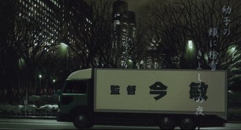 Movie still from “Tokyo Godfathers” (2003), directed by Shôgo Furuya – A truck driving down a street at night; Extreme Wide shot, Low angle
