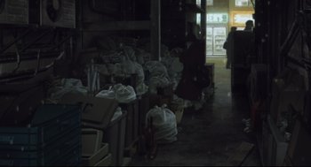 Movie still from “Tokyo Godfathers” (2003), directed by Shôgo Furuya – A room filled with lots of bags of garbage; Extreme Wide shot, Low angle