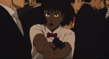 Movie still from “Tokyo Godfathers” (2003), directed by Shôgo Furuya – An animated woman holding a gun in a crowd of people; Close Up shot, High angle