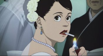 Movie still from “Tokyo Godfathers” (2003), directed by Shôgo Furuya – A woman is smoking a cigarette while holding a candle in her hand; Close Up shot, Low angle