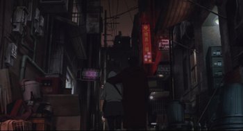 Movie still from “Tokyo Godfathers” (2003), directed by Shôgo Furuya – Two people walking down a street at night; Wide shot, Low angle