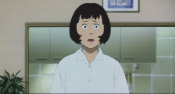 Movie still from “Tokyo Godfathers” (2003), directed by Shôgo Furuya – A woman with short black hair is looking surprised; Close Up shot, Low angle