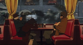 Movie still from “Tokyo Godfathers” (2003), directed by Shôgo Furuya – A group of people sitting at a table under an umbrella; Wide shot, High angle