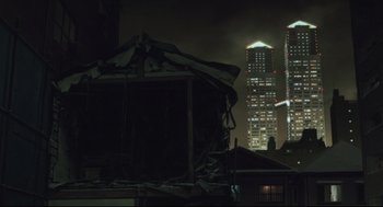 Movie still from “Tokyo Godfathers” (2003), directed by Shôgo Furuya – A building that has been demolished in the dark; Extreme Wide shot, Low angle