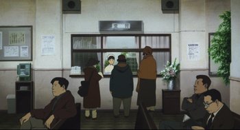 Movie still from “Tokyo Godfathers” (2003), directed by Shôgo Furuya – A group of people standing in front of a window; Wide shot, Low angle