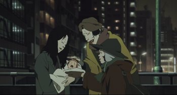 Movie still from “Tokyo Godfathers” (2003), directed by Shôgo Furuya – A group of people standing around a baby; Medium shot, Low angle