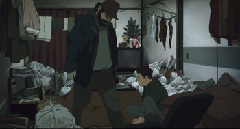 Movie still from “Tokyo Godfathers” (2003), directed by Shôgo Furuya – Two people in a room with a lot of stuff on the floor; Wide shot, High angle