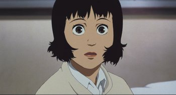 Movie still from “Tokyo Godfathers” (2003), directed by Shôgo Furuya – A person with short black hair; Close Up shot, Low angle