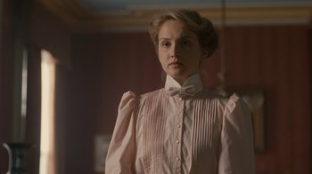 Movie still from “Anne with an E” (2017), created by Moira Walley-Beckett – A woman in a white shirt and a bow tie; Close Up shot, Low angle