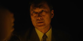 Movie still from “Tokyo Vice” (2022), created by J.T. Rogers – A person wearing a suit and tie; Close Up shot, Low angle