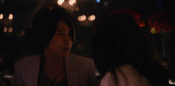 Movie still from “Tokyo Vice” (2022), created by J.T. Rogers – A man and a woman are sitting at a table; Close Up shot, Over the shoulder angle