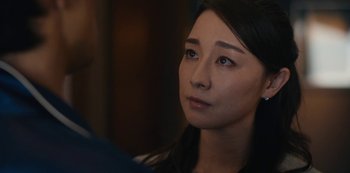 Movie still from “Tokyo Vice” (2022), created by J.T. Rogers – A person looking at something; Close Up shot, Over the shoulder angle