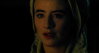 Movie still from “Tom Thumb” (2001), directed by Olivier Dahan – A person wearing a hood; Close Up shot, Over the shoulder angle