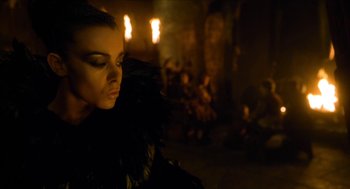 Movie still from “Tom Thumb” (2001), directed by Olivier Dahan – A person wearing a black jacket; Close Up shot, Low angle