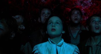 Movie still from “Tom Thumb” (2001), directed by Olivier Dahan – A group of children looking up at the sky at night; Medium shot, Low angle