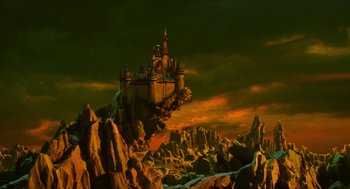 Movie still from “Tom Thumb” (2001), directed by Olivier Dahan – A castle on top of a mountain in the middle of the night; Extreme Wide shot, High angle