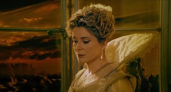 Movie still from “Tom Thumb” (2001), directed by Olivier Dahan – A person wearing a tiara; Close Up shot, Low angle