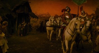 Movie still from “Tom Thumb” (2001), directed by Olivier Dahan – A group of people riding on the backs of horses; Wide shot, High angle