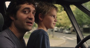 Movie still from “Tomboy” (2011), directed by Céline Sciamma – A man and a boy looking out of a car window; Close Up shot, Over the shoulder angle