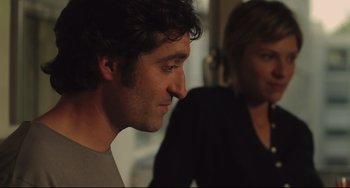 Movie still from “Tomboy” (2011), directed by Céline Sciamma – A man and a woman sitting next to each other in a room; Close Up shot, Over the shoulder angle