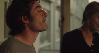 Movie still from “Tomboy” (2011), directed by Céline Sciamma – A person with his eyes closed; Close Up shot, Over the shoulder angle