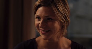 Movie still from “Tomboy” (2011), directed by Céline Sciamma – A person smiling for the camera; Close Up shot, Over the shoulder angle