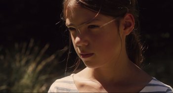 Movie still from “Tomboy” (2011), directed by Céline Sciamma – A young girl is looking into the distance; Close Up shot, Low angle