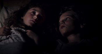 Movie still from “Tomboy” (2011), directed by Céline Sciamma – Two young children looking up at the sky; Close Up shot, Overhead angle
